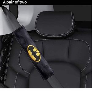 2 Batman carbon fiber black and yellow bat logo car seat belt cushioned pads.